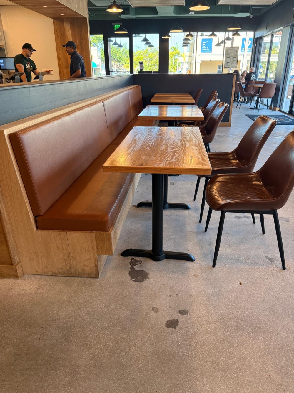 Restaurant banquette and leather chairs upholstered for a Miami venue